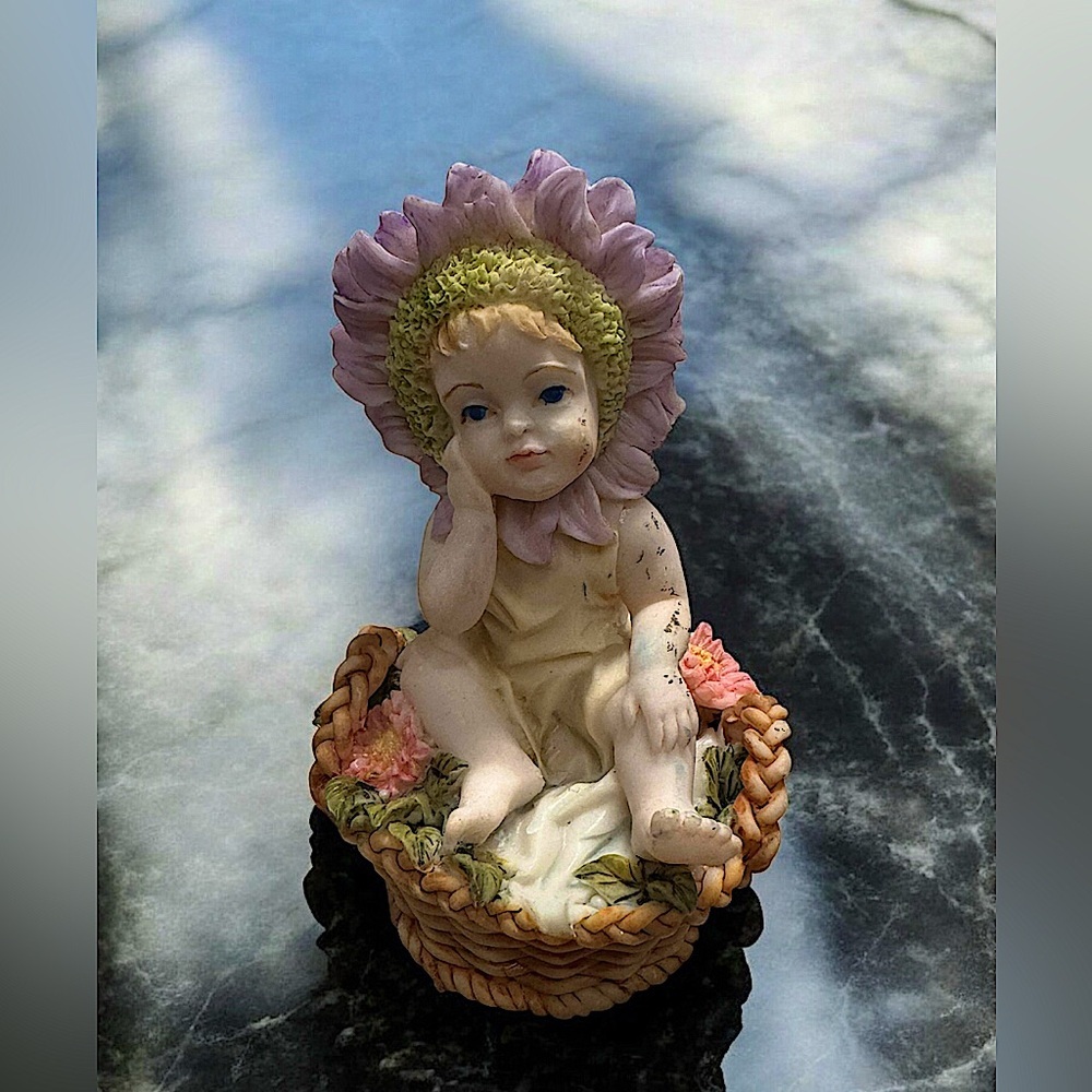 Floral Baby ceramic Figurine in Basket 4 1/2in tall